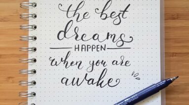 the best dreams happen when you are awake notebook and black pen